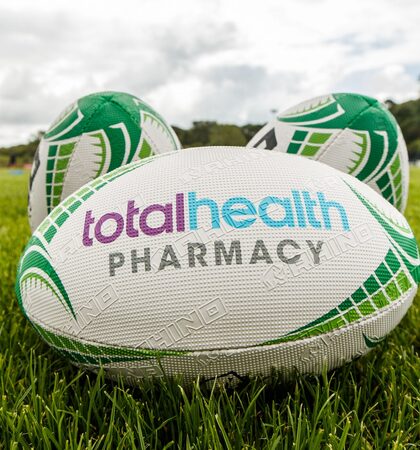 A view of total health pharmacy branding on rugby balls 7/8/2019