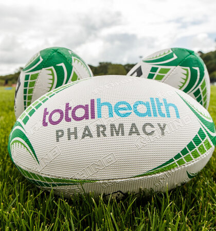 A view of total health pharmacy branding on rugby balls 7/8/2019