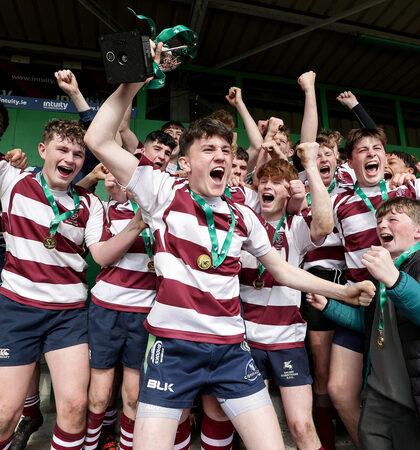 Euan Kavanagh lifts the trophy after the game 30/3/2022